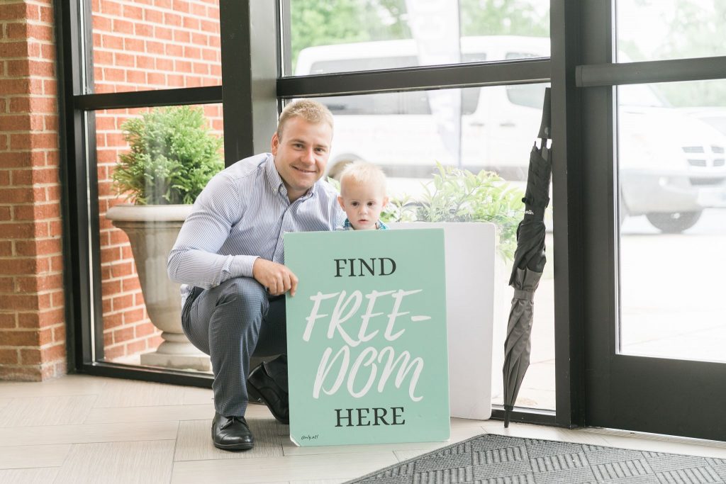 Father and son inviting church visitors to take next steps